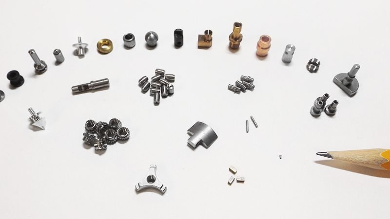 Precision-CNC-Micromachined-Miniature-Parts-With-Pencil (1)